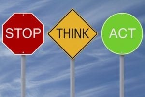Signs that say "STOP, THINK, ACT"
