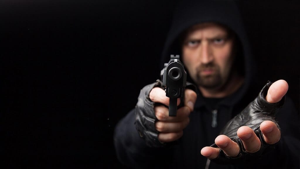Man in black with a gun