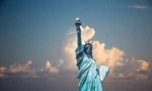 Statue of liberty with clouds in background