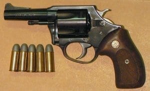 Charter Arms revolver with bullets next to it