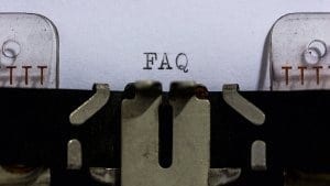 Closeup of "FAQ" typed by a typewriter