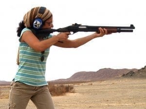 8 Person shooting a Henry Rifle