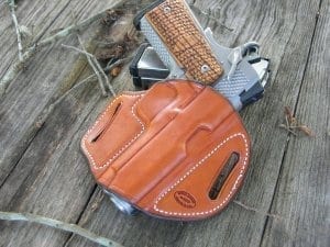 Firearm inside of red-brown holster