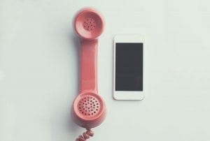 Telephone and smartphone side by side