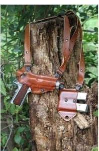 Brown weapon holster slung over tree stump