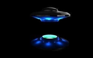Picture of small alien craft with reflection on black surface