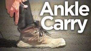 Photo of ankle holster with white text that says "Ankle Carry"